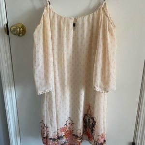 Dress that has not be worn much. The shoulder is open and sleeves come to elbows